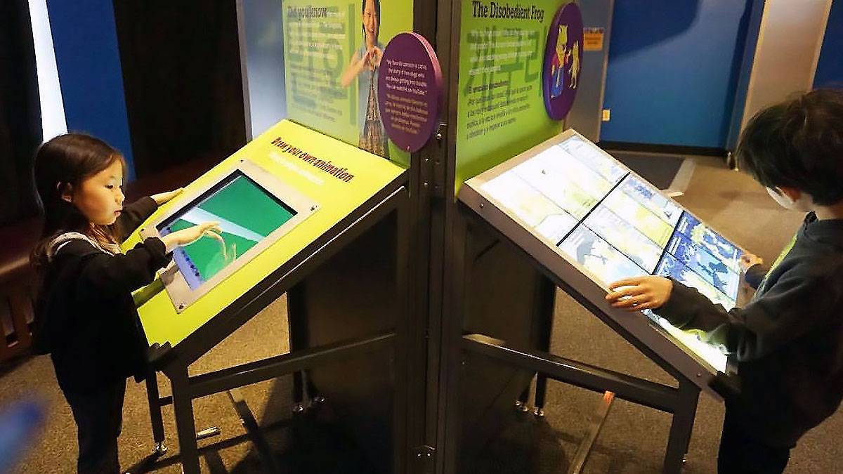 children looking at displays inside the Chicago Children's Museum in Chicago, Illinois, USA